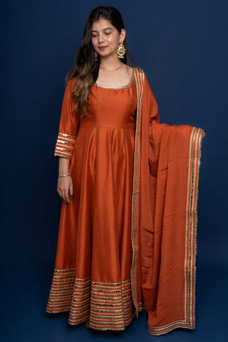 Rust Meher : Metallic orange Anarkali Suit Set.